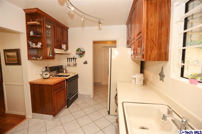 324 East Ramona Road Alhambra, CA 91801 - Photo 15 of 72 a kitchen with stainless steel appliances granite countertop a sink and a refrigerator