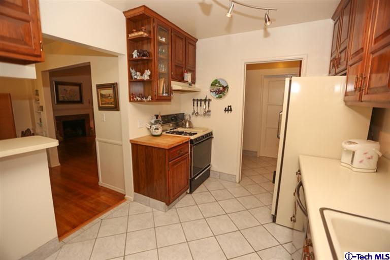 324 East Ramona Road Alhambra, CA 91801 - Photo 16 of 72 a kitchen with stainless steel appliances a refrigerator and a stove
