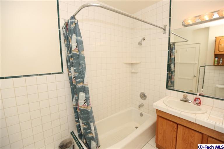 324 East Ramona Road Alhambra, CA 91801 - Photo 23 of 72 a bathroom with a granite countertop sink a toilet and shower