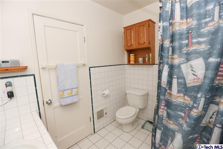 324 East Ramona Road Alhambra, CA 91801 - Photo 26 of 72 a white toilet sitting next to a bathroom sink