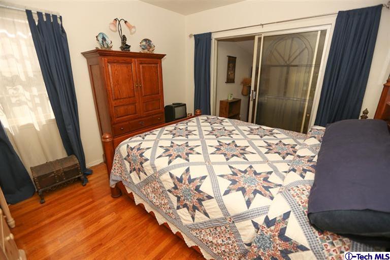 324 East Ramona Road Alhambra, CA 91801 - Photo 27 of 72 a bedroom with a bed and a mirror on dresser