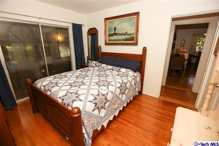324 East Ramona Road Alhambra, CA 91801 - Photo 29 of 72 a bedroom with a bed and a mirror