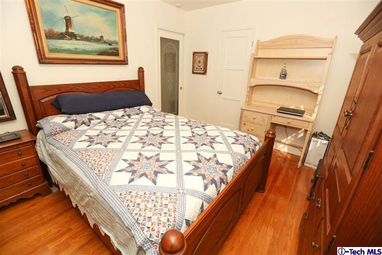 324 East Ramona Road Alhambra, CA 91801 - Photo 30 of 72 a bedroom with a bed and a painting on the wall
