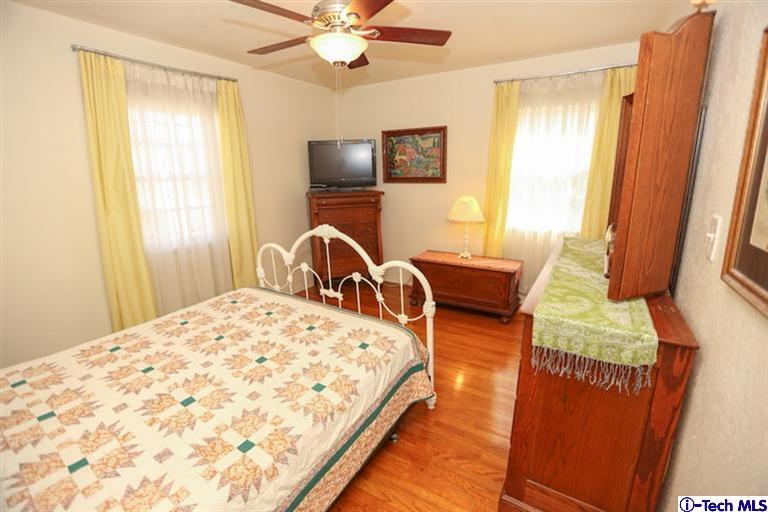 324 East Ramona Road Alhambra, CA 91801 - Photo 33 of 72 a bedroom with wooden floor bed and a window