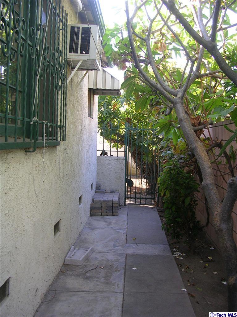 324 East Ramona Road Alhambra, CA 91801 - Photo 36 of 72 a pathway of a house with a yard