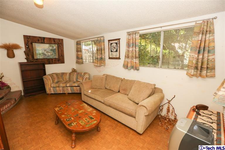 324 East Ramona Road Alhambra, CA 91801 - Photo 39 of 72 a living room with furniture and a flat screen tv