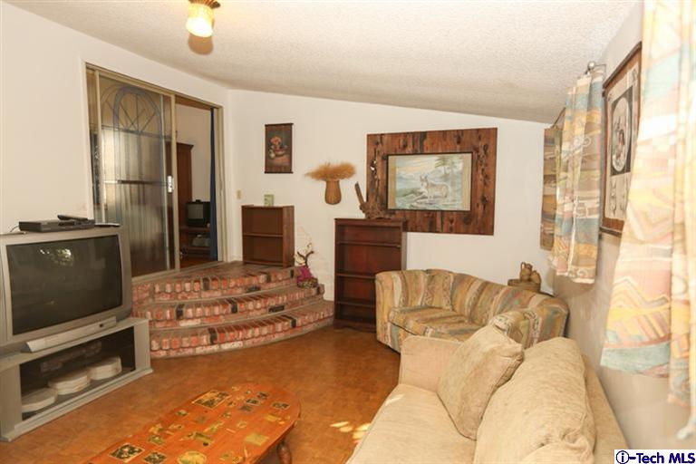 324 East Ramona Road Alhambra, CA 91801 - Photo 40 of 72 a living room with furniture and a flat screen tv