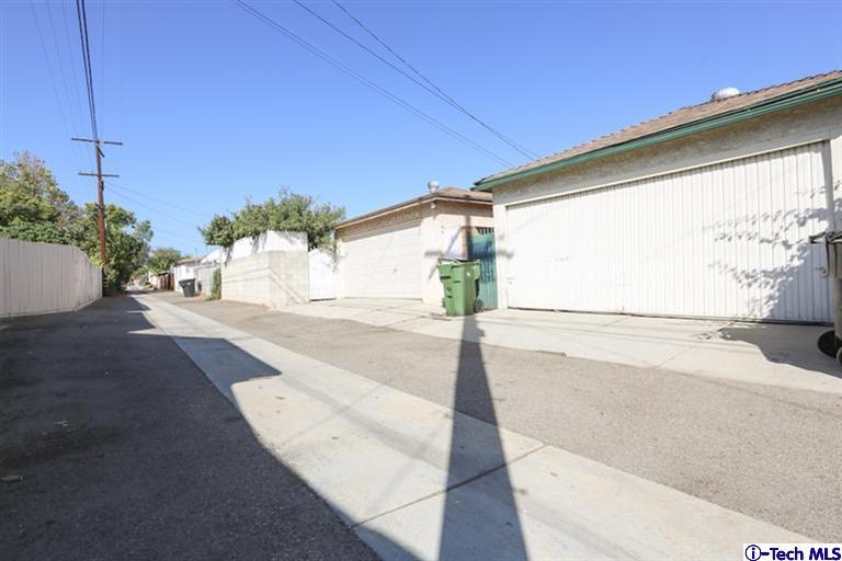 324 East Ramona Road Alhambra, CA 91801 - Photo 44 of 72 a house with a yard and a wooden fence