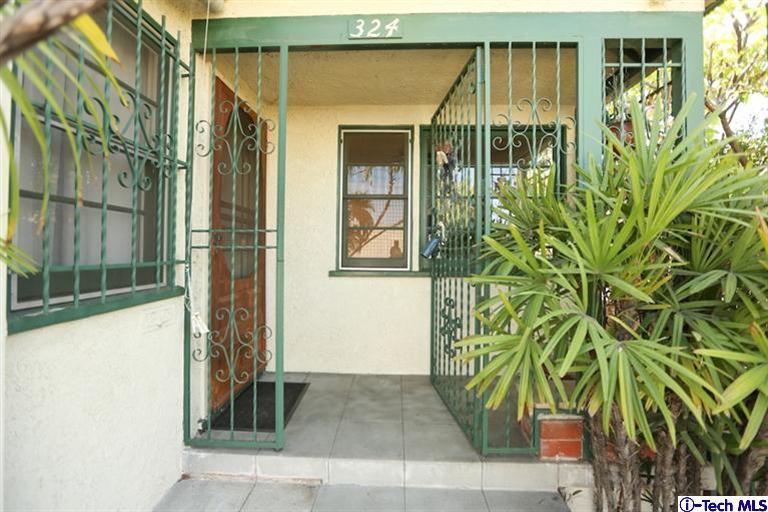 324 East Ramona Road Alhambra, CA 91801 - Photo 51 of 72 front view of a house with a garden