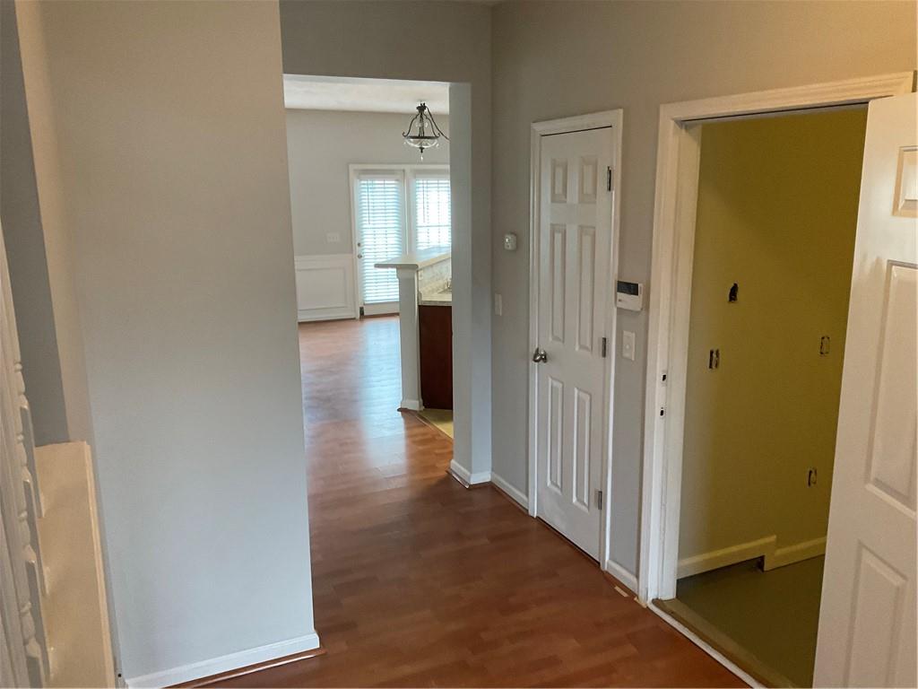 2555 Flat Shoals Road, Unit 1703 Atlanta, GA 30349 - Photo 17 of 26 a view of a hallway with wooden floor