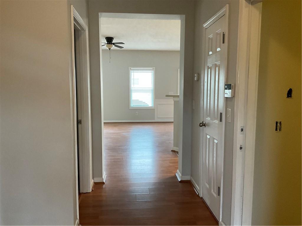 2555 Flat Shoals Road, Unit 1703 Atlanta, GA 30349 - Photo 18 of 26 a view of a hallway with wooden floor