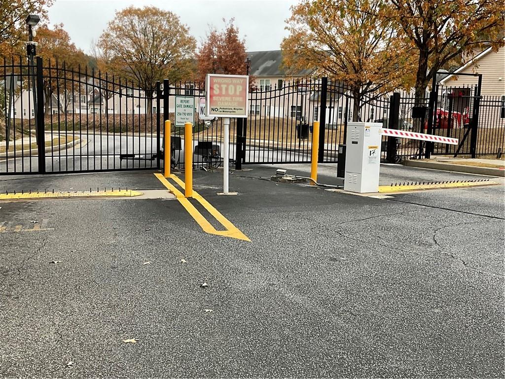 2555 Flat Shoals Road, Unit 1703 Atlanta, GA 30349 - Photo 21 of 26 a view of street with parked cars
