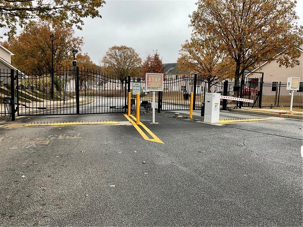 2555 Flat Shoals Road, Unit 1703 Atlanta, GA 30349 - Photo 22 of 26 a view of a street with houses