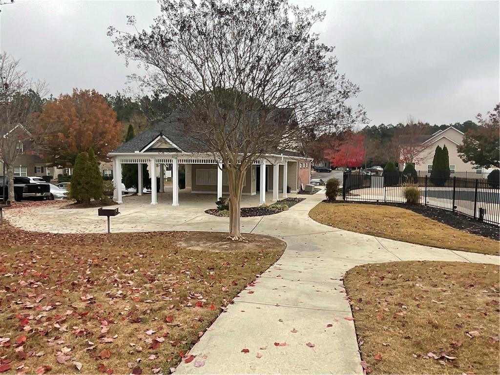 2555 Flat Shoals Road, Unit 1703 Atlanta, GA 30349 - Photo 23 of 26 a view of a house with a yard