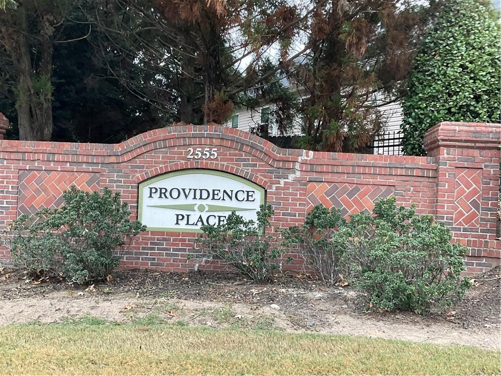 2555 Flat Shoals Road, Unit 1703 Atlanta, GA 30349 - Photo 25 of 26 a sign on the side of a building