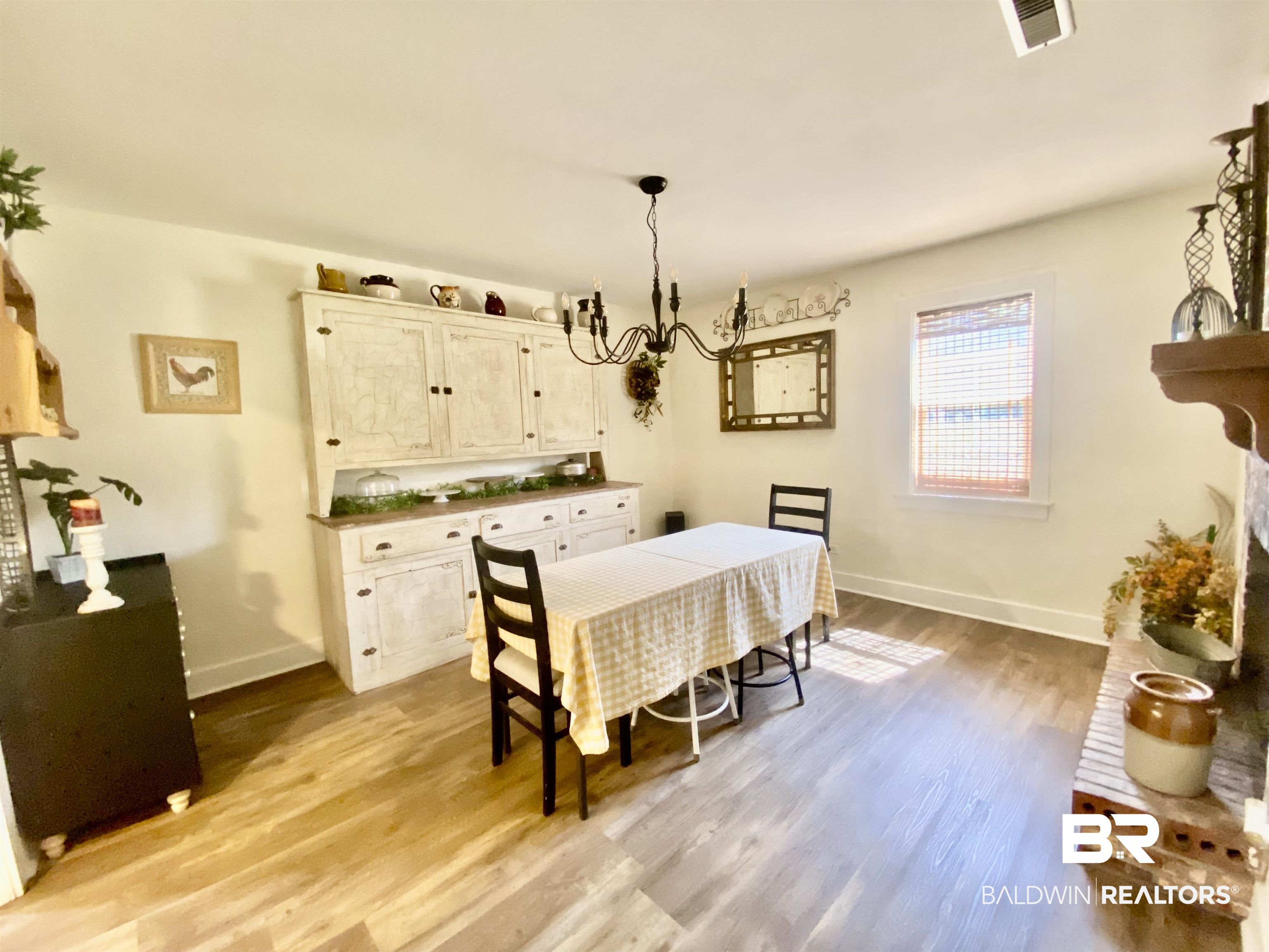 531 Highway 136 Monroeville, AL 36460 - Photo 23 of 48 Dining area with a notable chandelier and light hardwood / wood-style flooring
