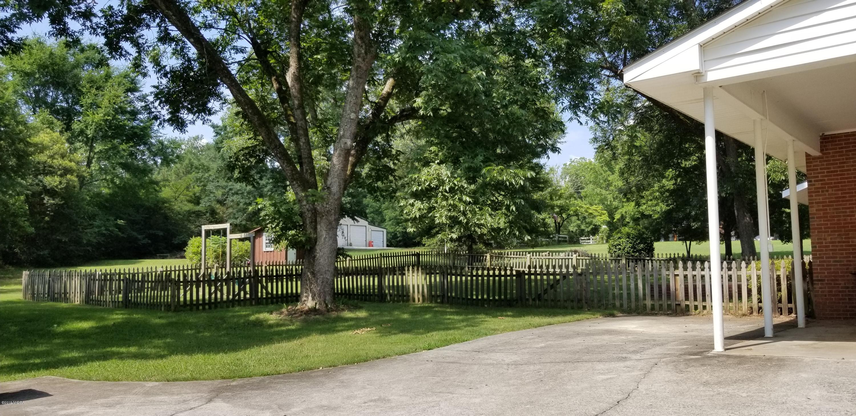 2718 Allen Road Macon, GA 31216 - Photo 2 of 12 a view of a park that has large trees and plants