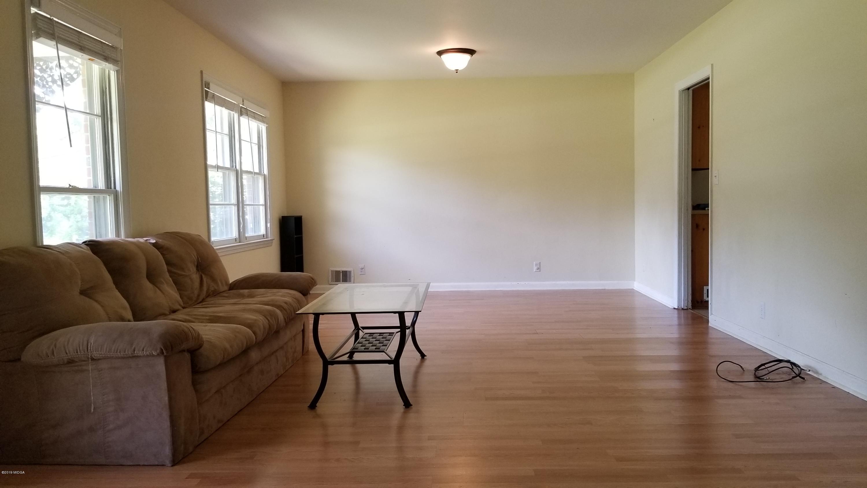 2718 Allen Road Macon, GA 31216 - Photo 4 of 12 a living room with furniture and a window