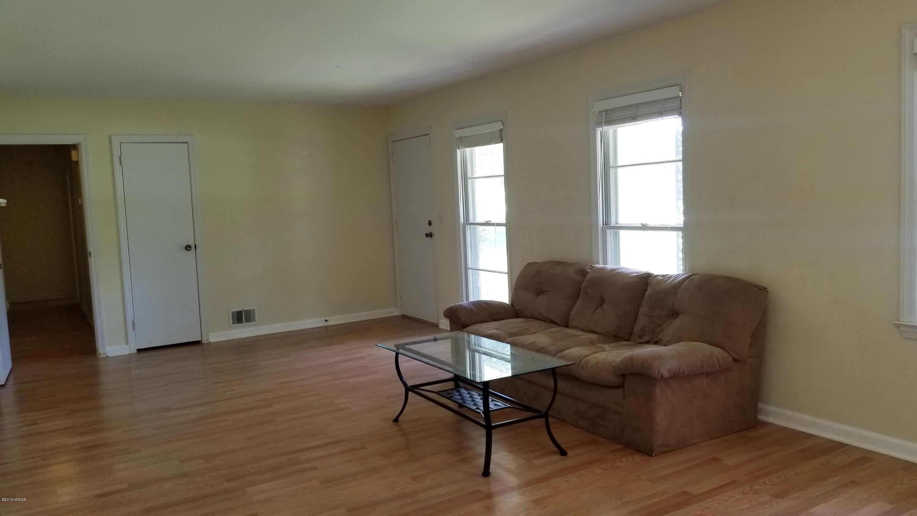 2718 Allen Road Macon, GA 31216 - Photo 5 of 12 a living room with furniture and a window