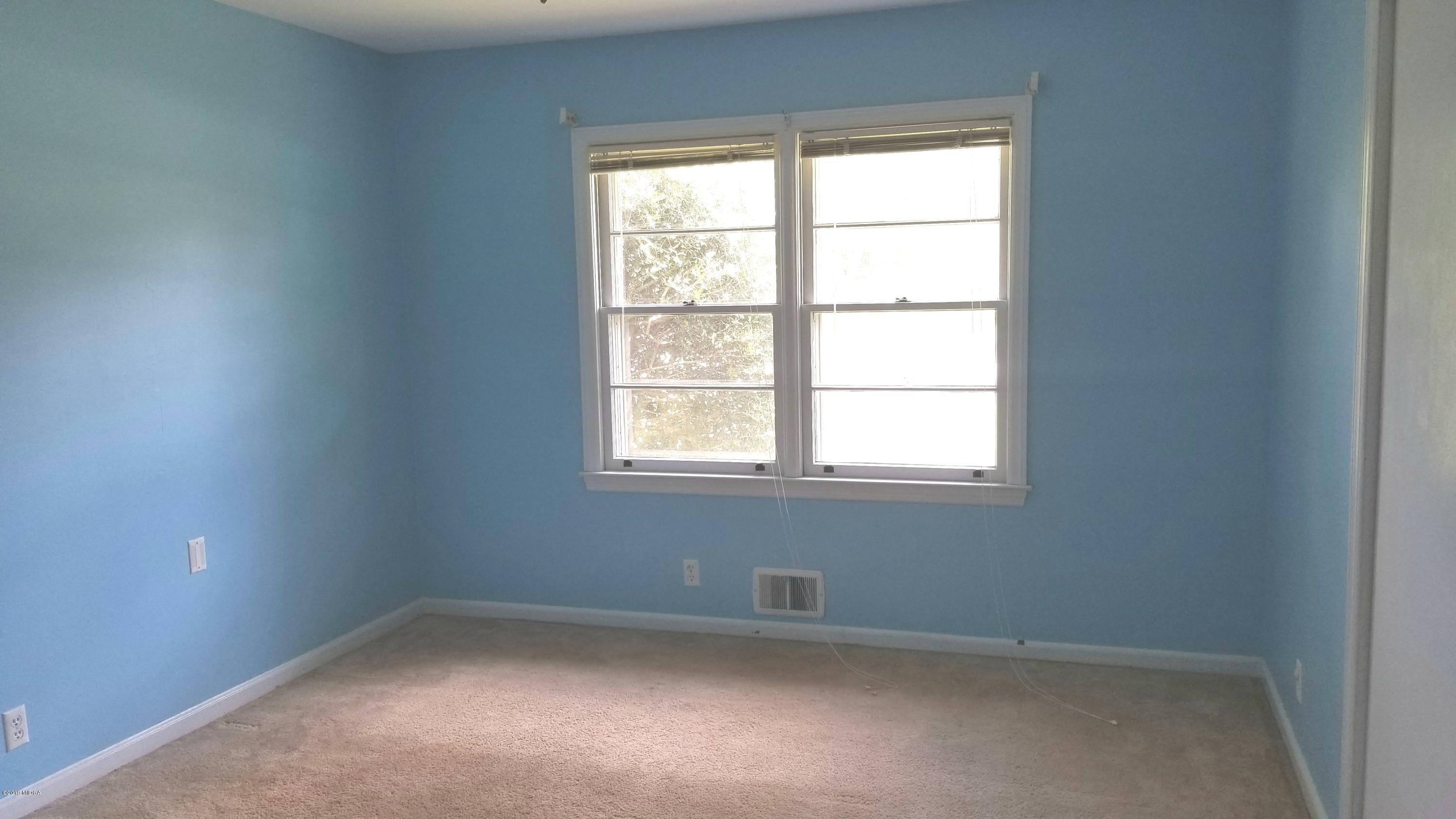 2718 Allen Road Macon, GA 31216 - Photo 9 of 12 an empty room with a window