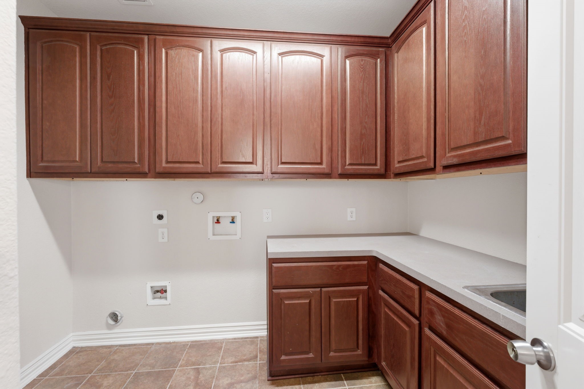 315 Arbor Ridge Lane Conroe, TX 77384 - Photo 25 of 48 a kitchen with a sink and cabinets
