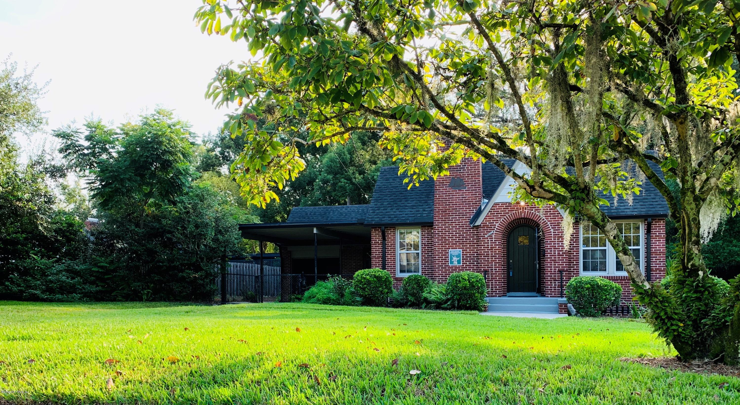 3827 Gadsden Road Jacksonville, FL 32207 - Photo 1 of 25 a front view of a house with yard and green space