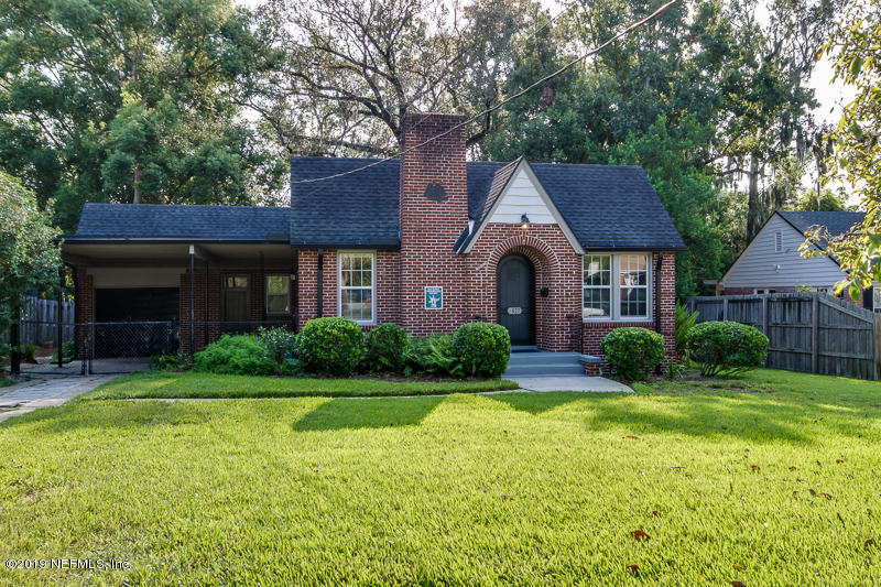 3827 Gadsden Road Jacksonville, FL 32207 - Photo 25 of 25 a front view of a house with garden and trees