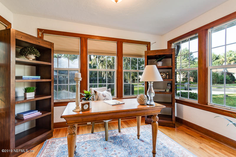 3827 Gadsden Road Jacksonville, FL 32207 - Photo 8 of 25 a living room filled with furniture and a floor to ceiling window