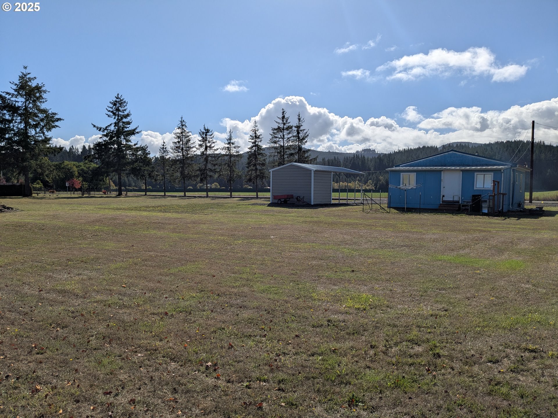 28475 Andy Riggs Road Grand Ronde, OR 97347 - Photo 2 of 15 a view of a big room with table and chairs