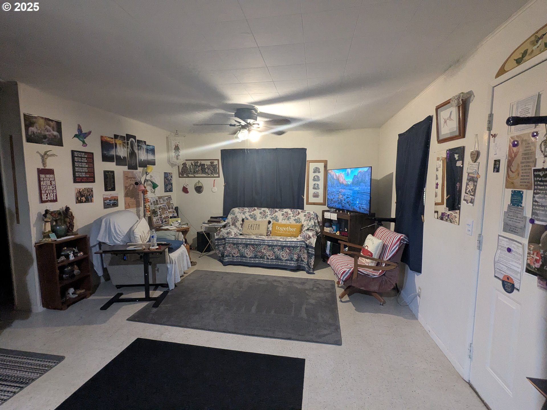28475 Andy Riggs Road Grand Ronde, OR 97347 - Photo 4 of 15 a living room with furniture and a flat screen tv