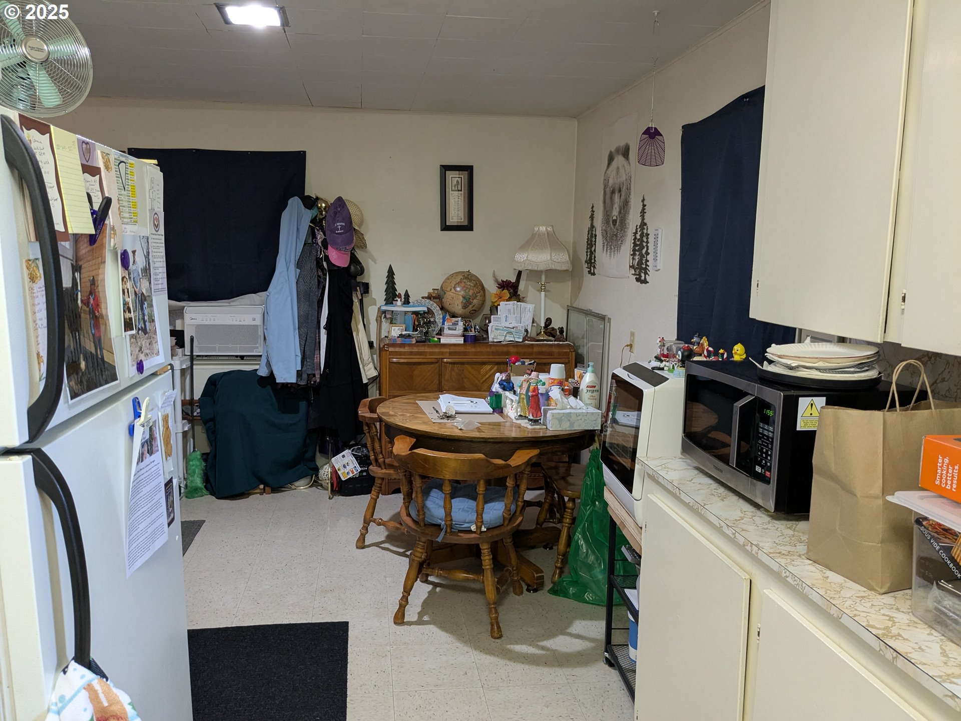 28475 Andy Riggs Road Grand Ronde, OR 97347 - Photo 5 of 15 a view of a dining room with furniture and a kitchen