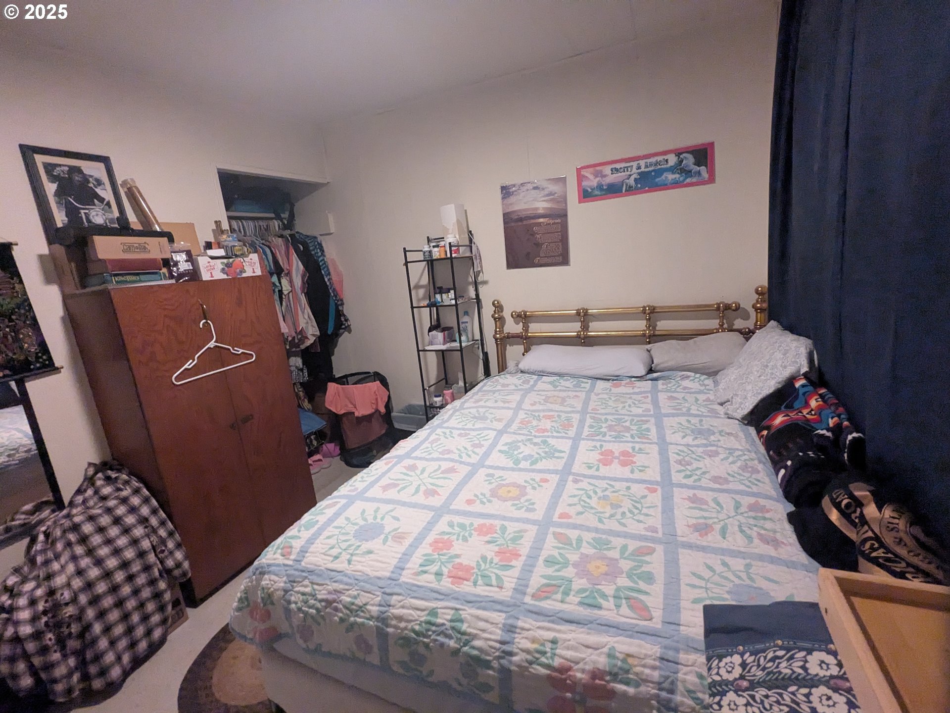 28475 Andy Riggs Road Grand Ronde, OR 97347 - Photo 6 of 15 a bedroom with a bed and wooden floor