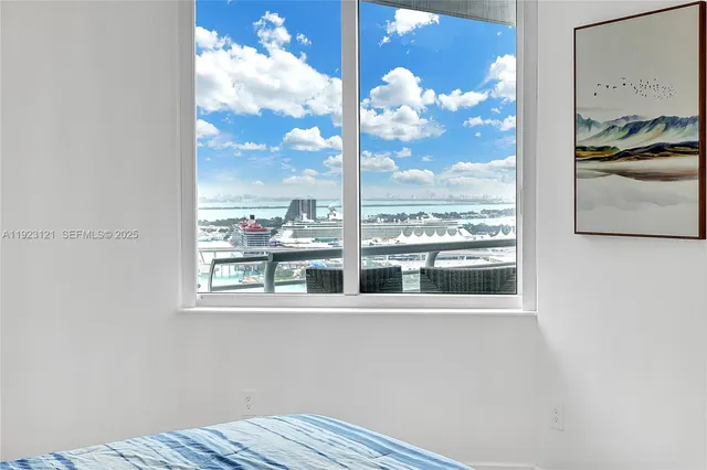 a view of a room with a large window