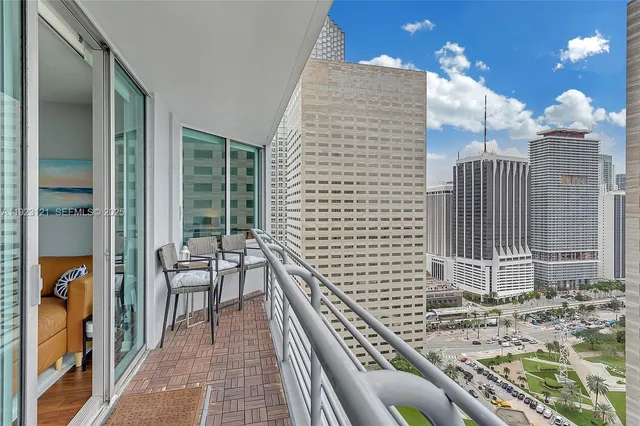 a view of a balcony with wooden floor