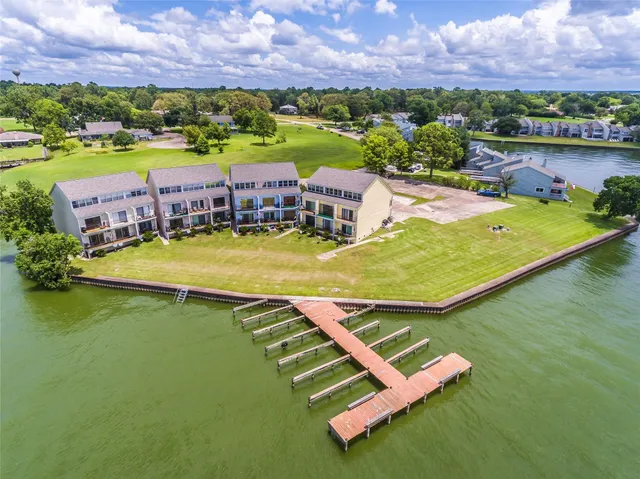 an aerial view of a house with a ocean view
