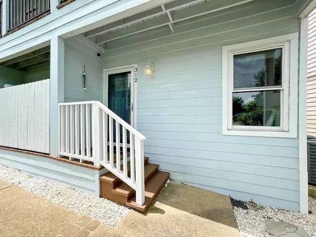 a view of a house with a small yard