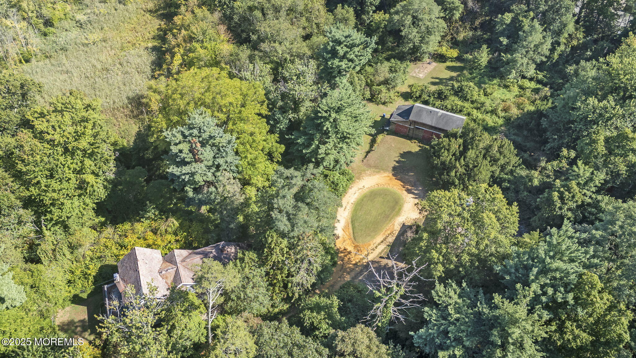 100 Highway 33 Freehold, NJ 07728 - Photo 12 of 26 a aerial view of a house with a yard and outdoor seating