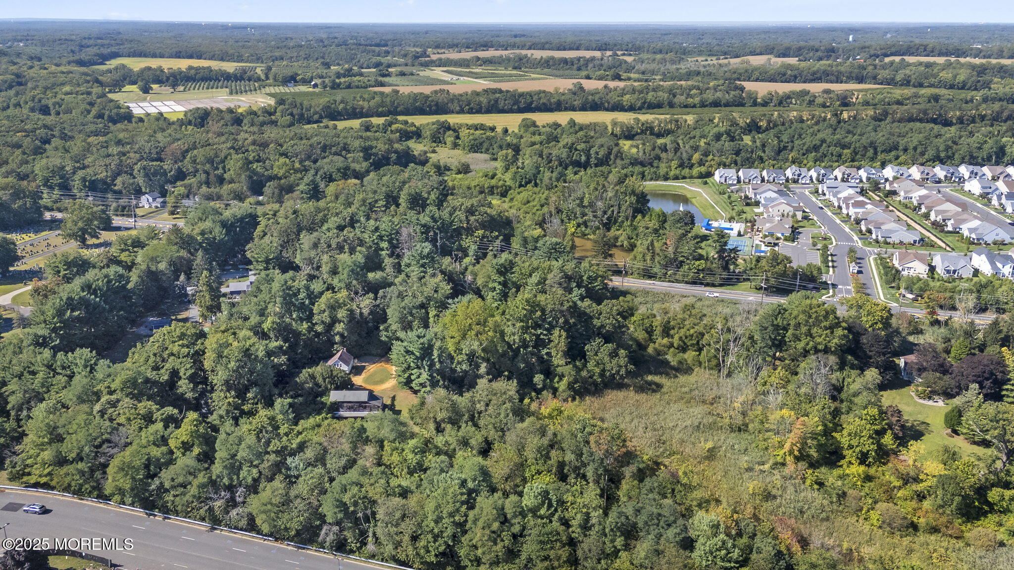 100 Highway 33 Freehold, NJ 07728 - Photo 14 of 26 an aerial view of residential houses with outdoor space and trees