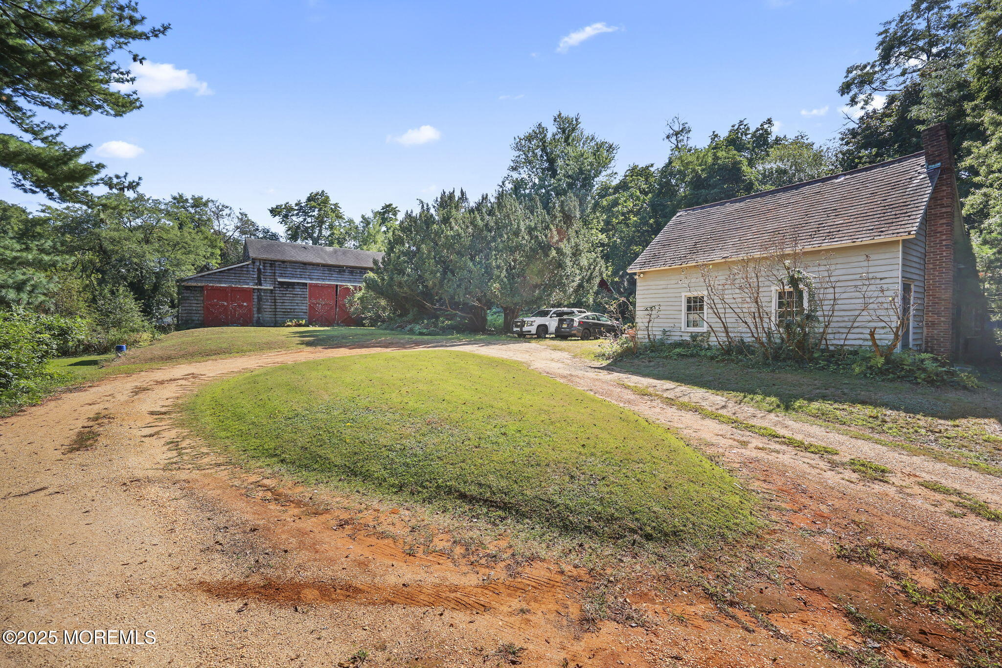 100 Highway 33 Freehold, NJ 07728 - Photo 22 of 26 a view of a house with a yard and a garage