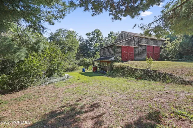 a view of a yard with large trees