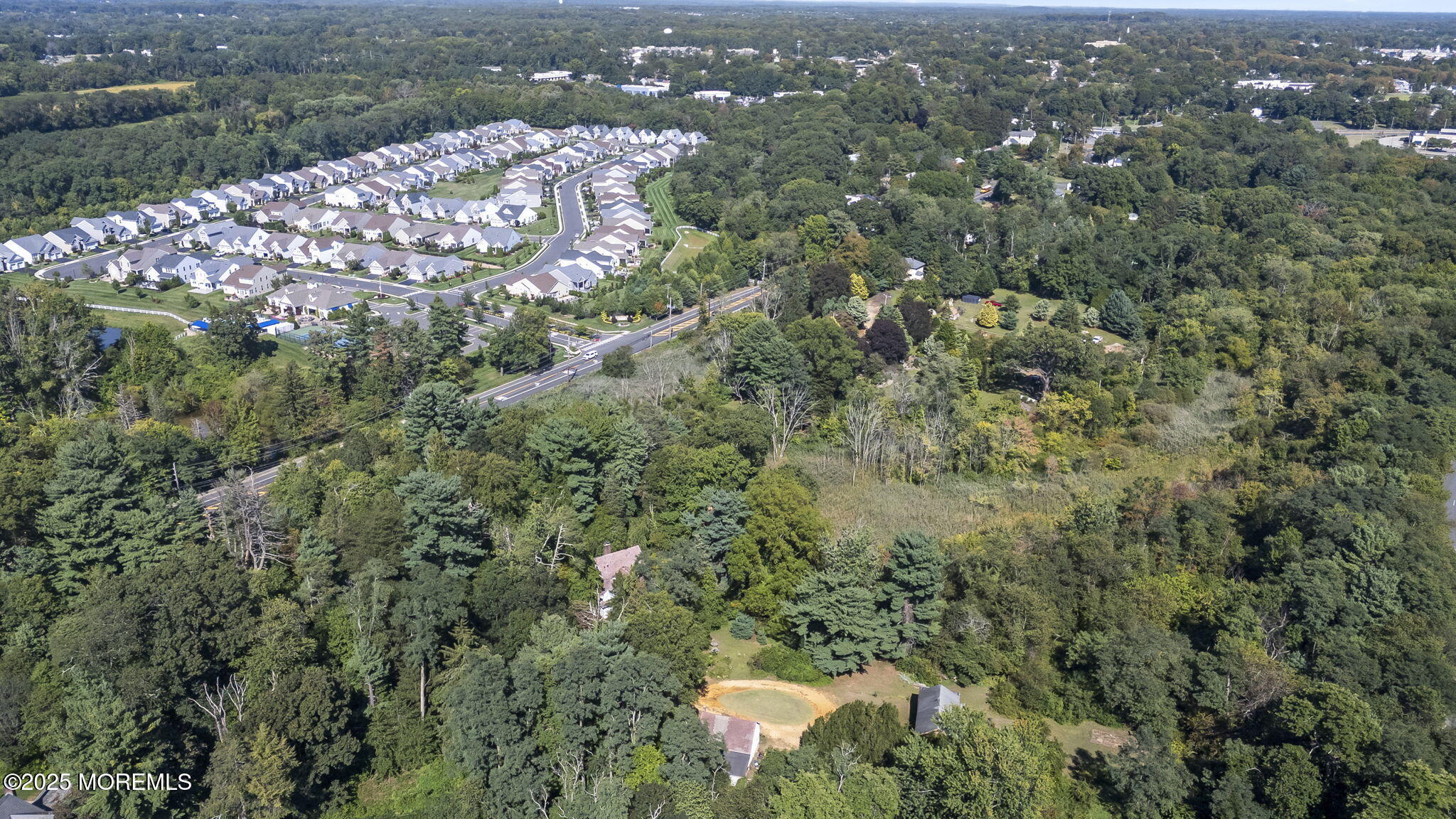 100 Highway 33 Freehold, NJ 07728 - Photo 7 of 26 an aerial view of residential houses with outdoor space