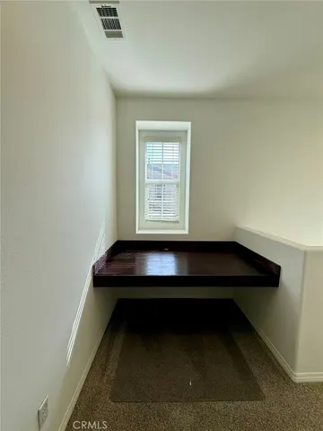 a room with a table and a window