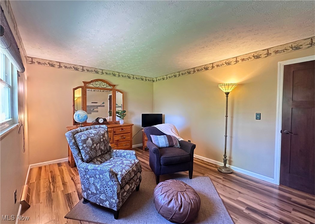 157 Birch Road Painesville, OH 44077 - Photo 18 of 41 bedroom featuring a textured ceiling, wood finished floors, and baseboards