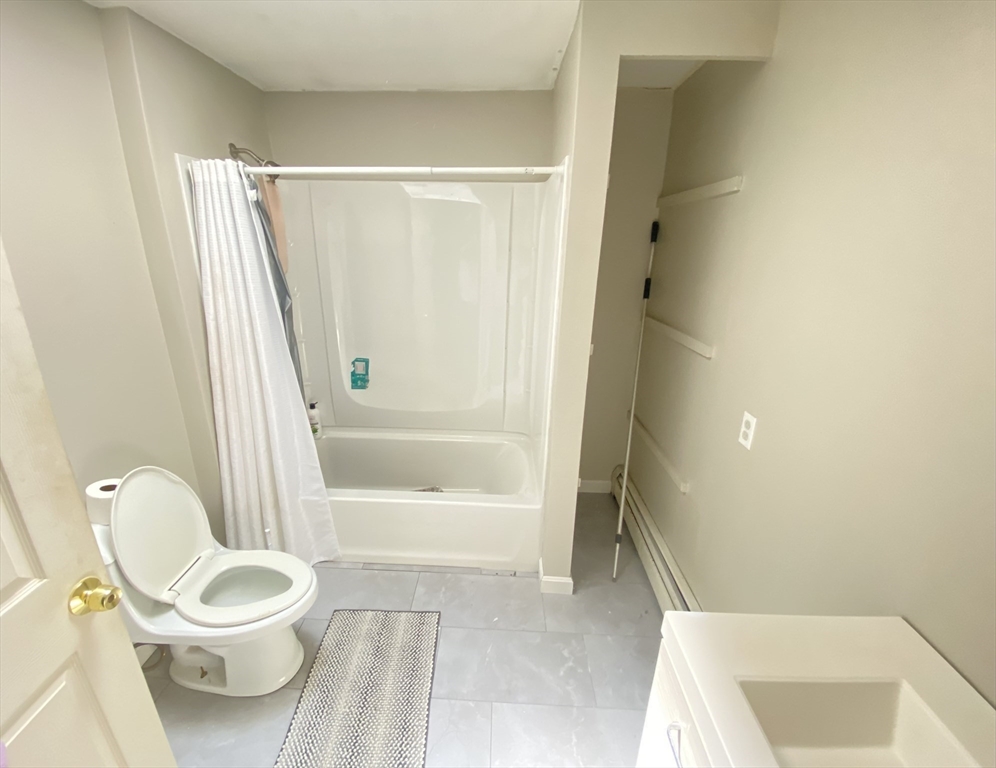 266 Massasoit Road Worcester, MA 01604 - Photo 11 of 26 a bathroom with a toilet and a shower