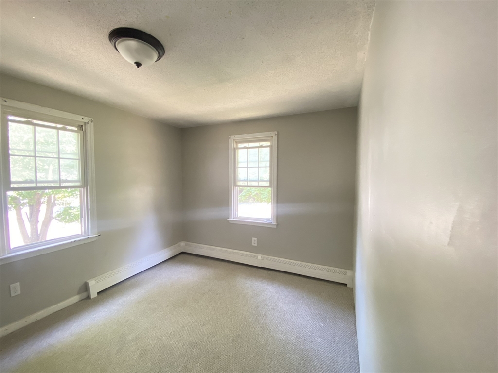 266 Massasoit Road Worcester, MA 01604 - Photo 15 of 26 an empty room with a window
