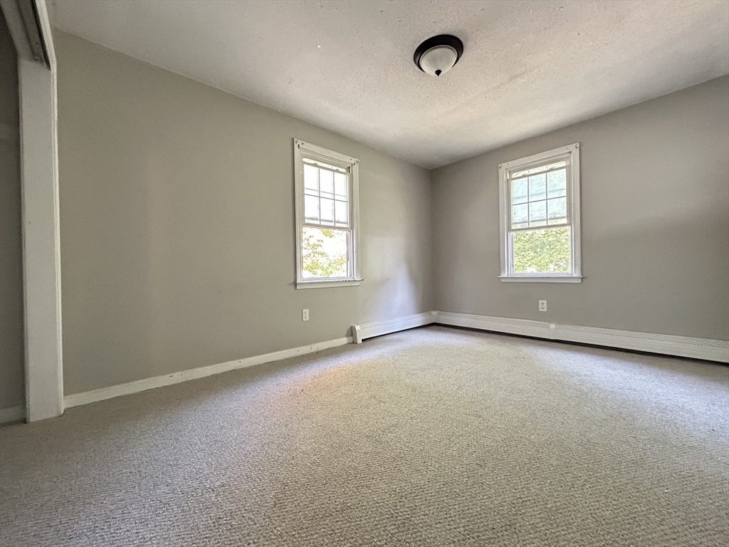 266 Massasoit Road Worcester, MA 01604 - Photo 16 of 26 an empty room with windows