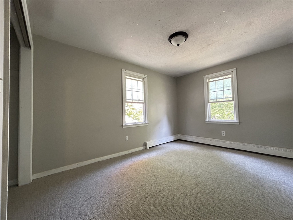266 Massasoit Road Worcester, MA 01604 - Photo 19 of 26 an empty room with windows