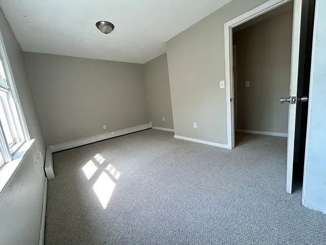 an empty room with a empty space and a window