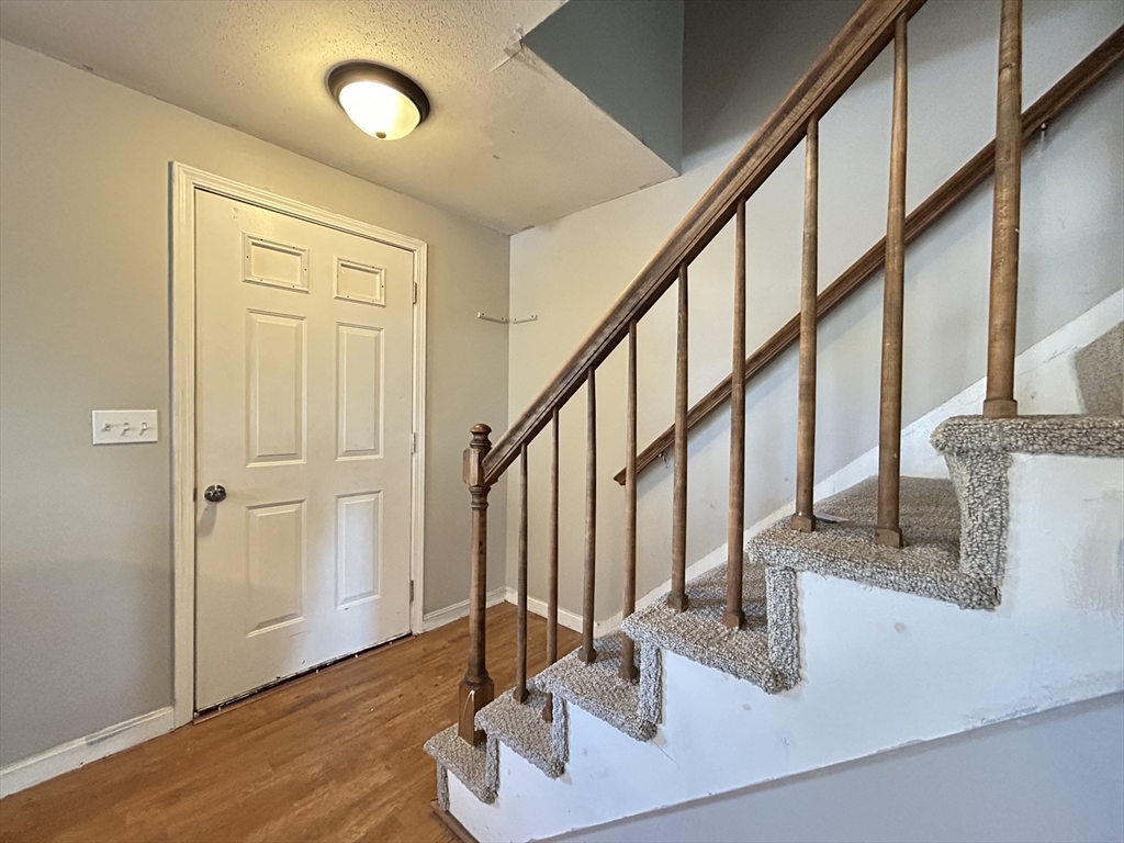 266 Massasoit Road Worcester, MA 01604 - Photo 8 of 26 a view of entryway and hall with wooden floor