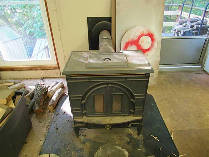 135 Hamel Road Renfrew, PA 16053 - Photo 18 of 21 Other. Wood burner in garage. Stays with the house